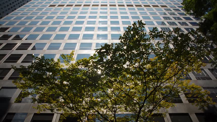 The exterior of an office building in a city