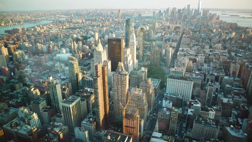 Skyscrapers stand in a large city in the daytime