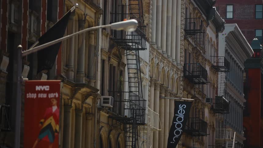 Buildings and banners line a city street
