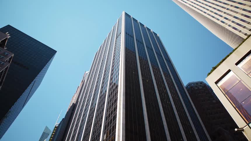 Tall skyscrapers in downtown against a clear blue sky