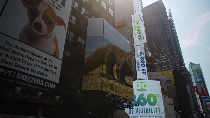 Billboards and digital advertisements on the outside of skyscrapers in a metropolis during the day