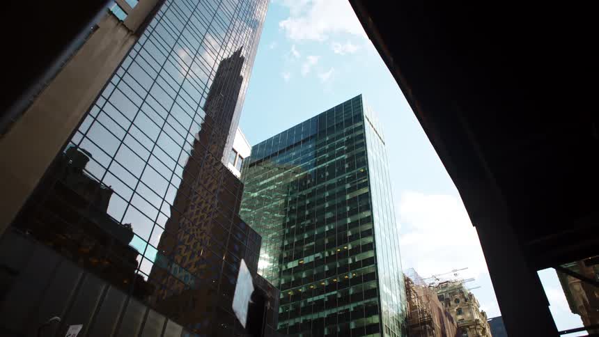 A city with buildings and skyscrapers with the sky and clouds above