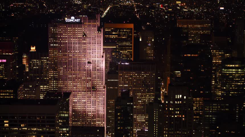 Office buildings lit up in a city at night