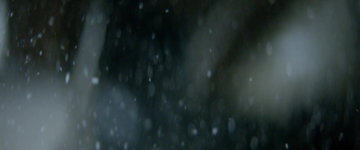Ice shavings fall down towards the ground