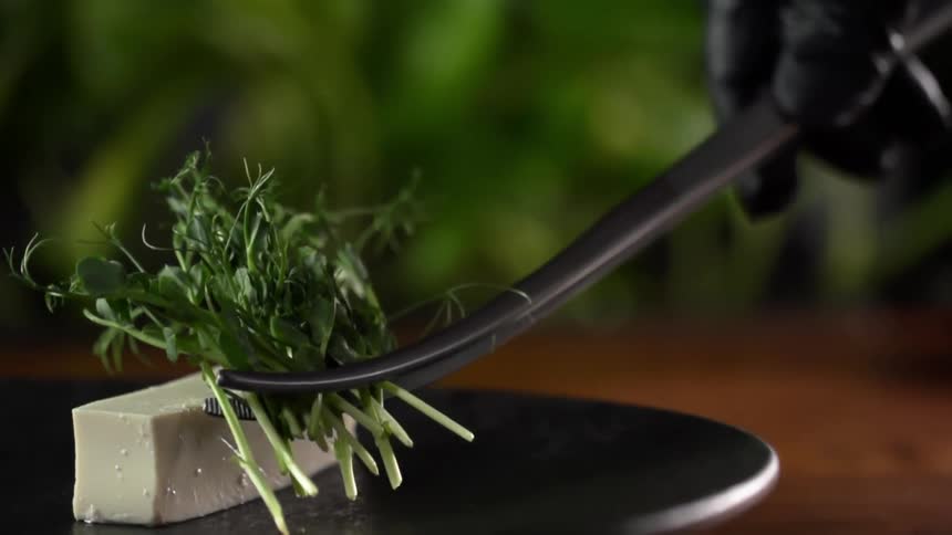 Garnish is placed on tofu