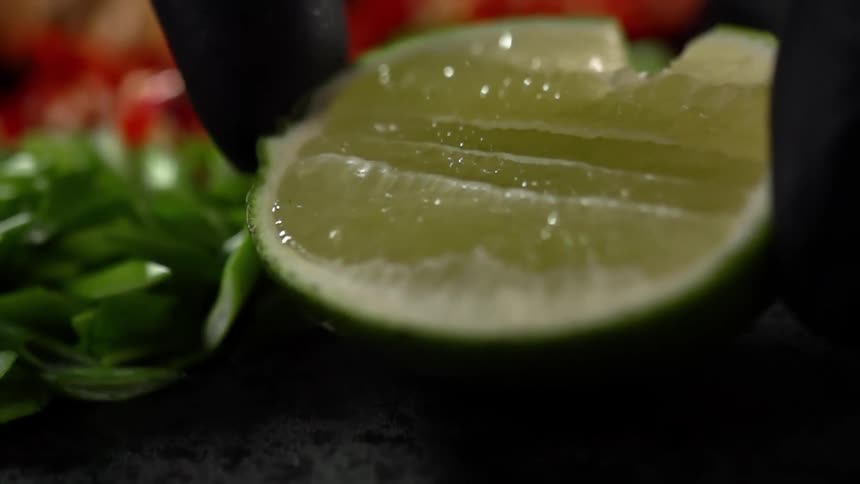 A lime half is placed next to the vegetables