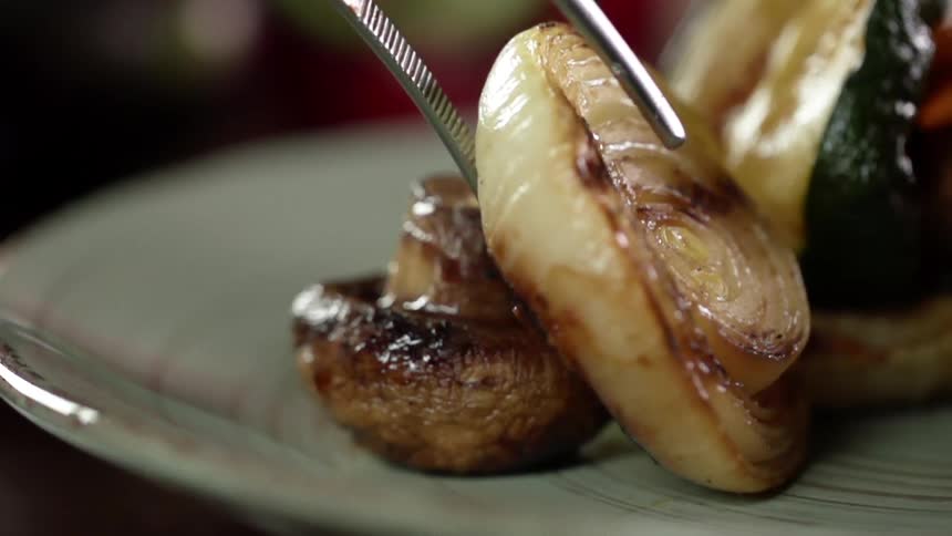 A cooked onion is placed on the plate