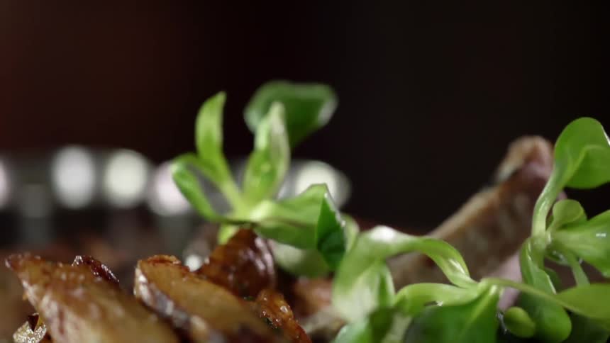 Greens are added on top of a meal