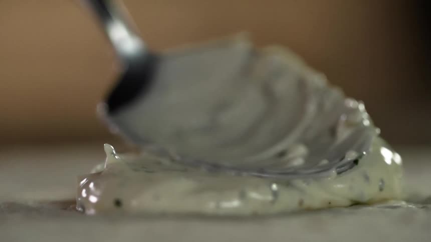 Cream is spread with a spoon