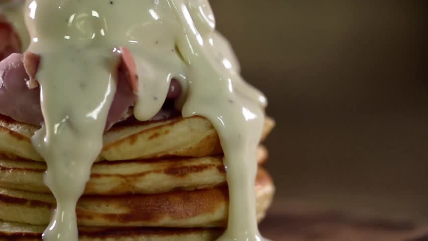 Sauce drizzled over a stack of pancakes