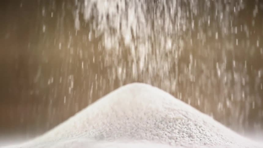 Wheat flour falls on countertop