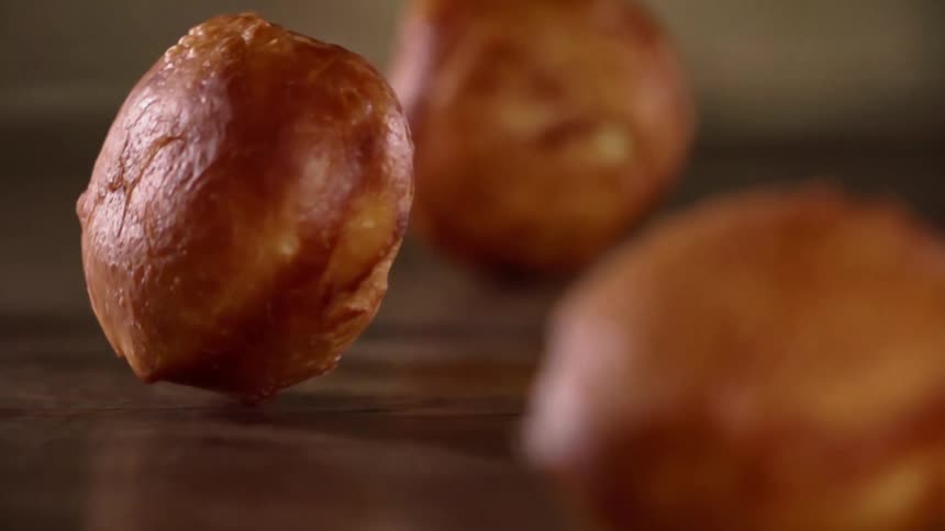 Pastries fall onto a wood table