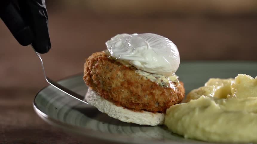 A person plating food