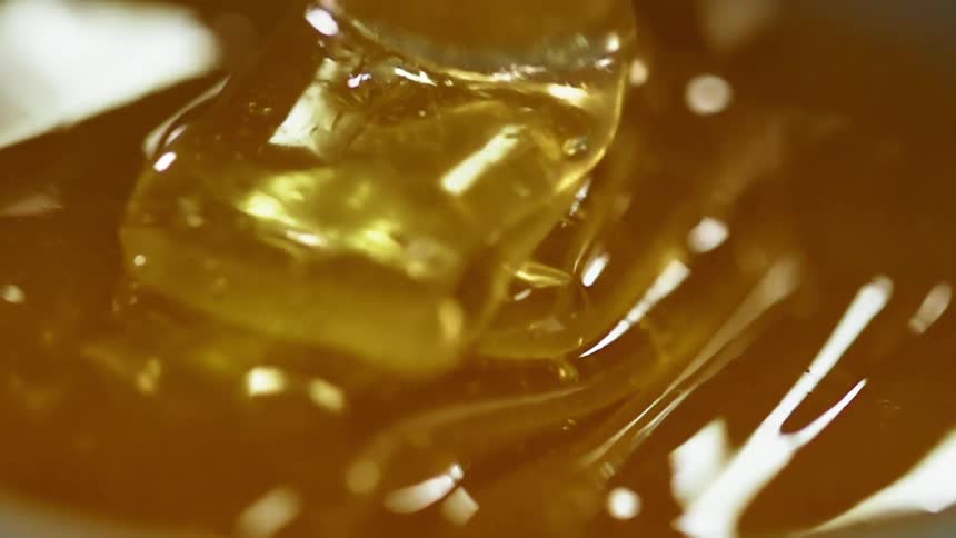 Honey is poured in a back and forth ribbon pattern