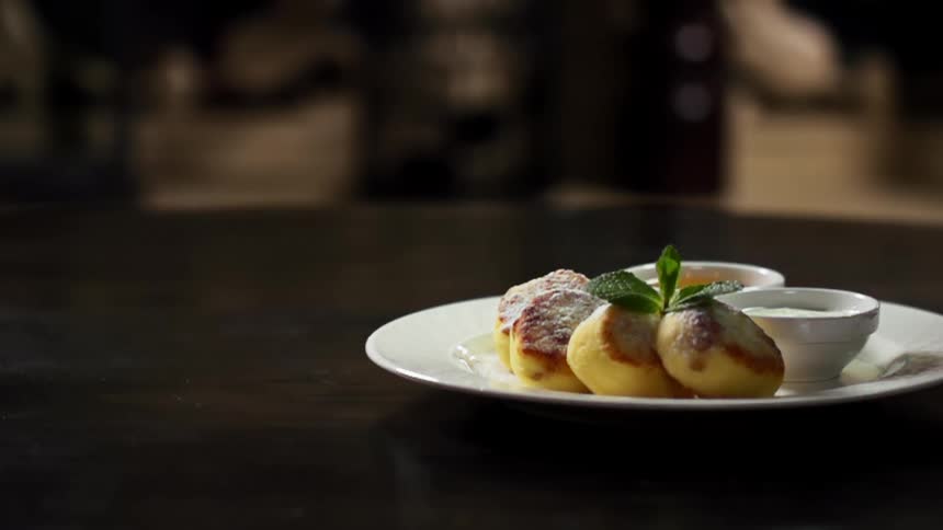 A garnish is added to a plate of food