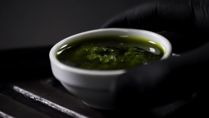 A person setting a bowl down
