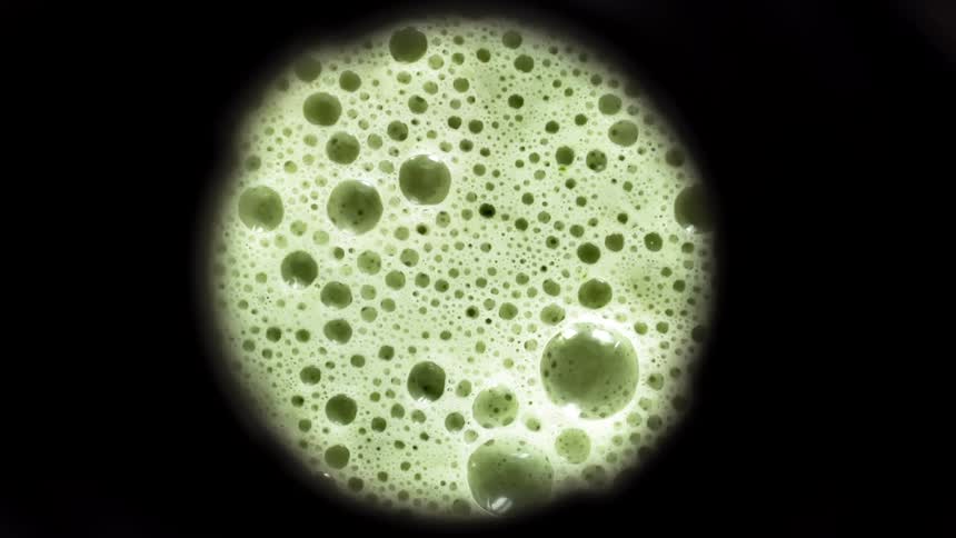 A smoothie blending in a blender