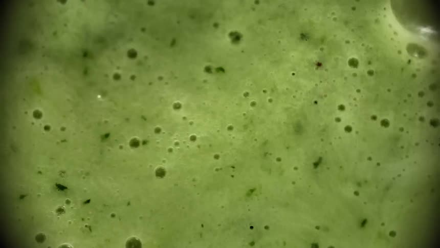A smoothie is blended in a blender