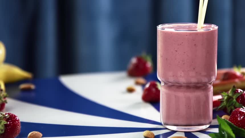 A person puts straws in to a smoothie