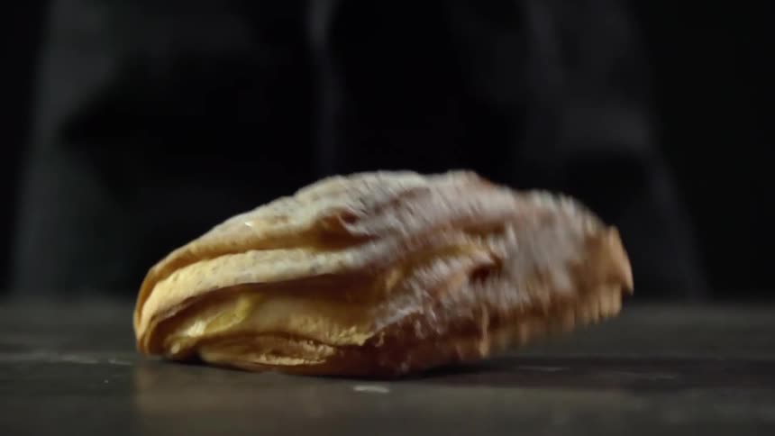 Fresh bread is dropped and bounces on the table