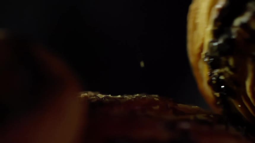 A pastry falls onto a pile of pastries