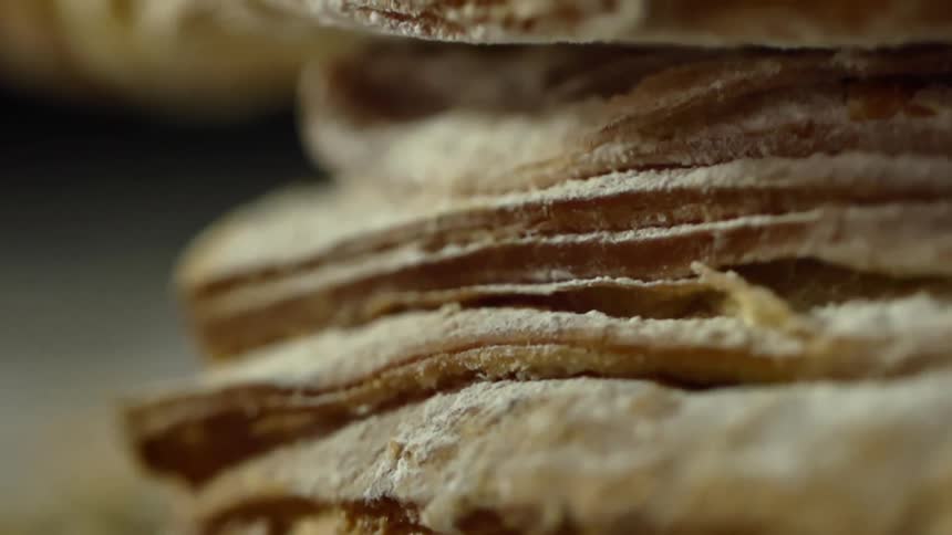 A stack of bread covered in flour