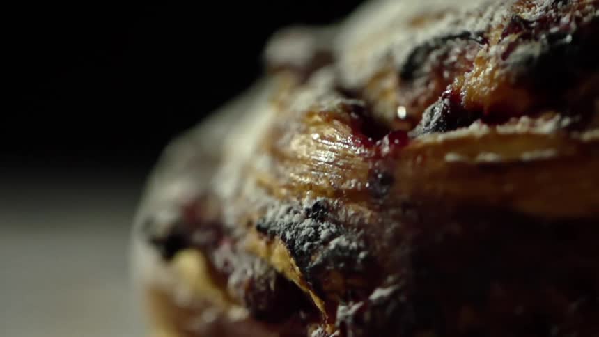 Bread on a table with a black background
