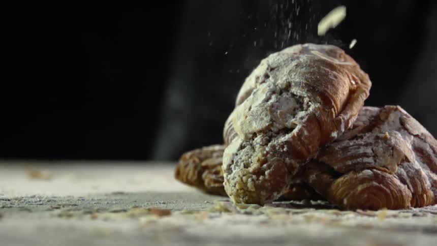 Nuts sprinkle on three bread pastries