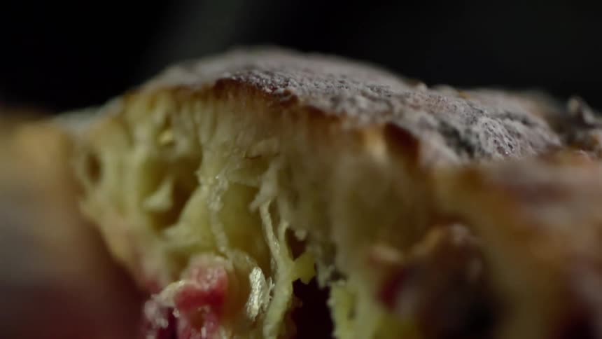 Bread being cut in half