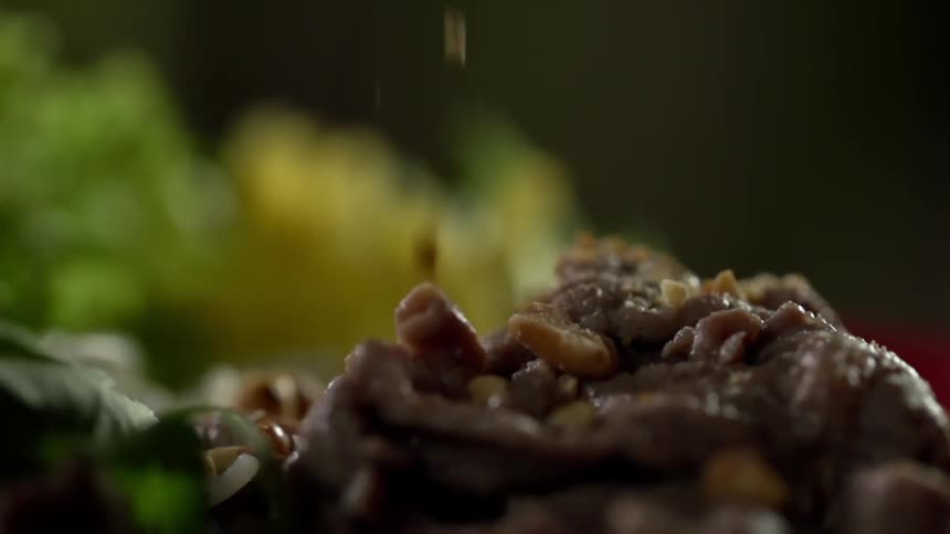 Food sprinkles onto a meal