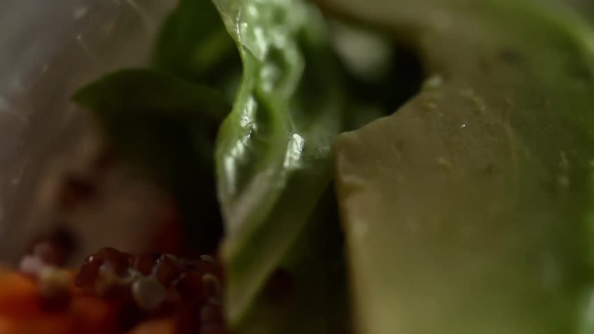 Close up of vegetable filling inside a wrapped food