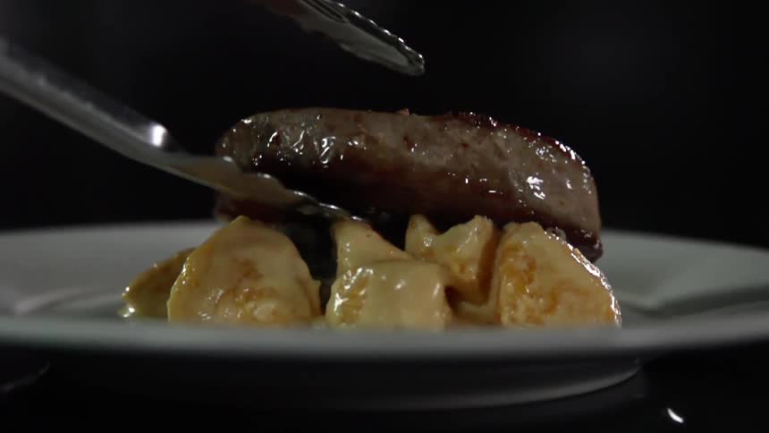 A steak is placed on the plate
