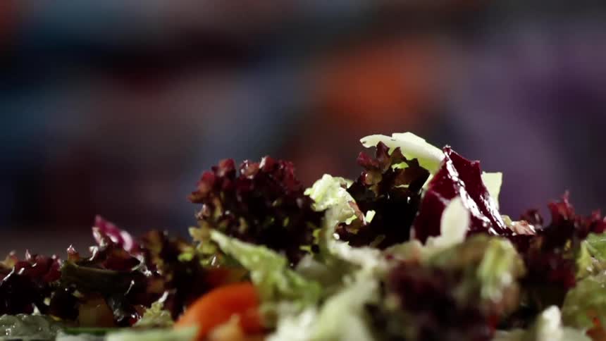 The dish is a salad with many vegetables