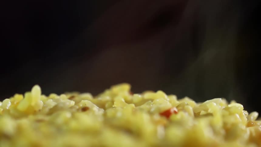 Steam rising from a dish of rice