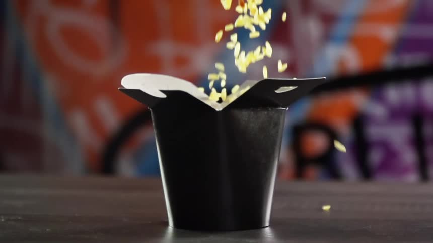 Rice drops into a small meal box