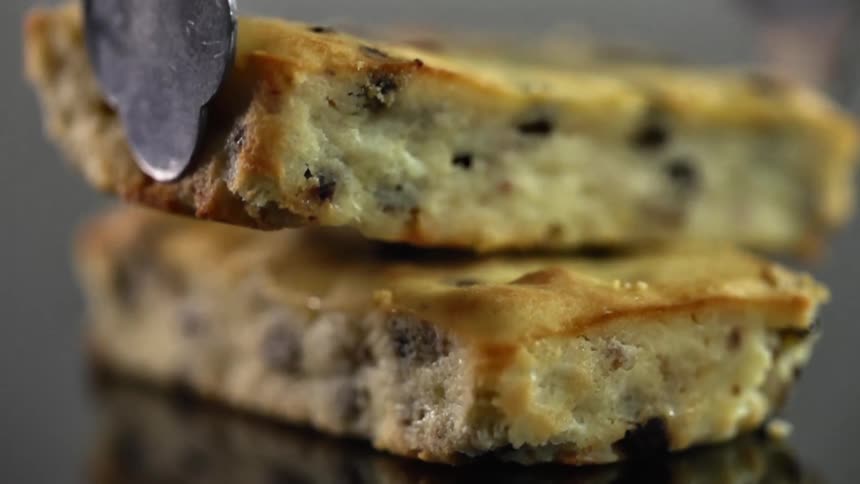 Square pieces of sweet cake filled with chocolate chips piled up