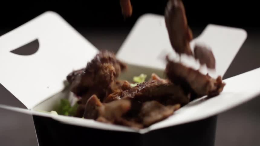 Meat chunks drop into a food box