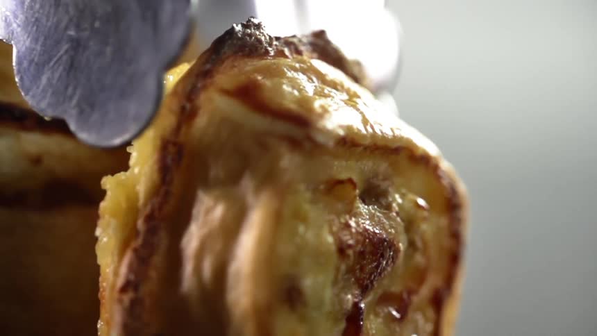 A pastry being set down