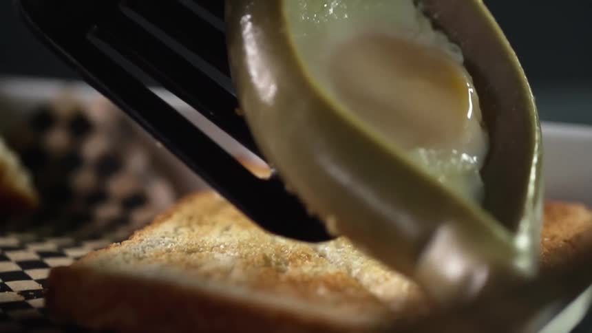 An egg is placed on some toast