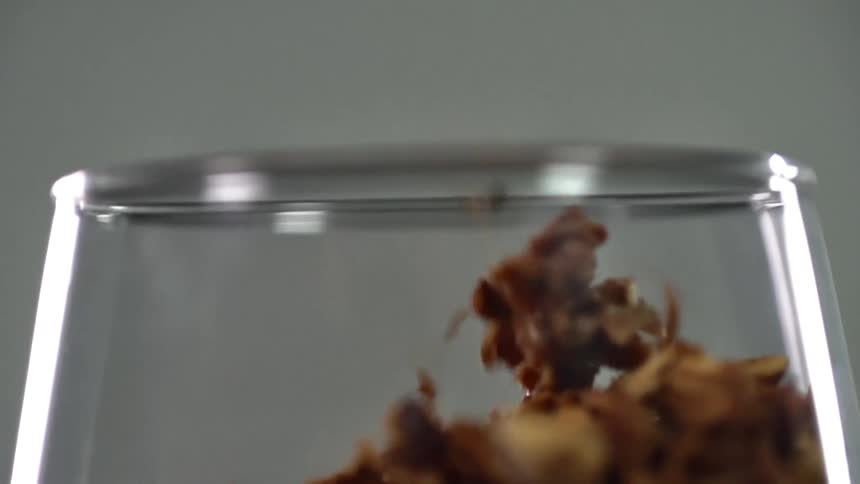 Food is dropped into the clear glass