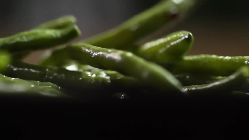 Asparagus tumbles onto a plate