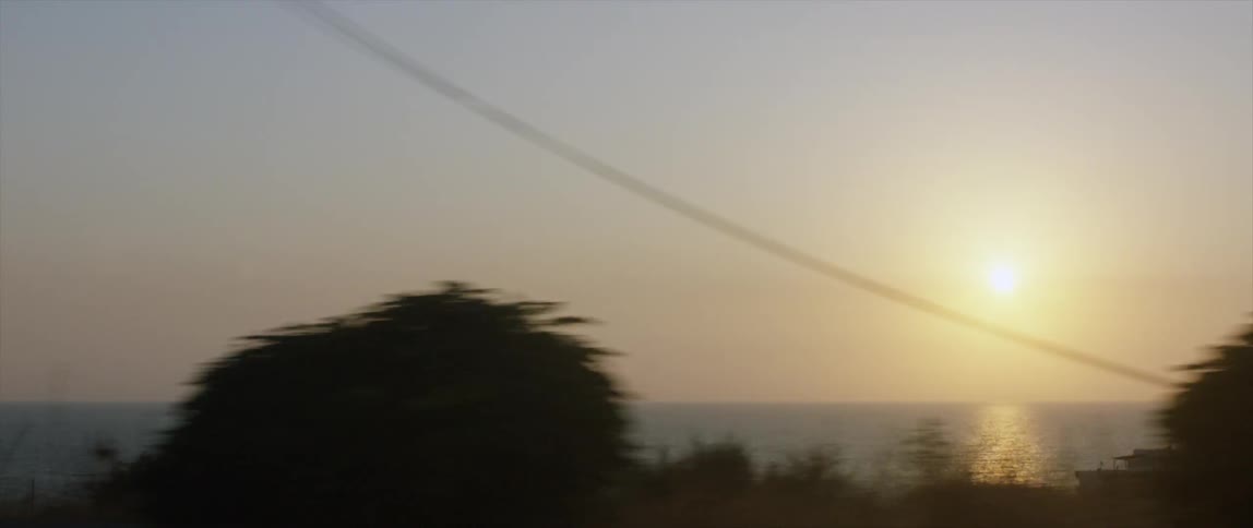 The sun sets over the ocean