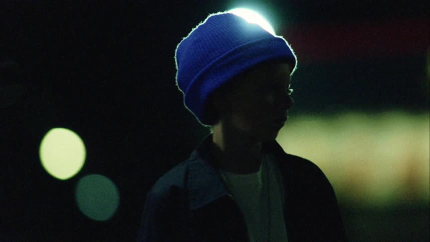 A child is walking at night time