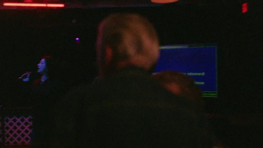 People are dancing as someone sings