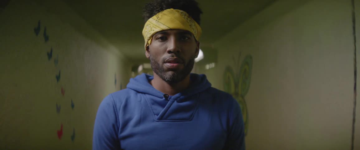 A man stands in a hallway