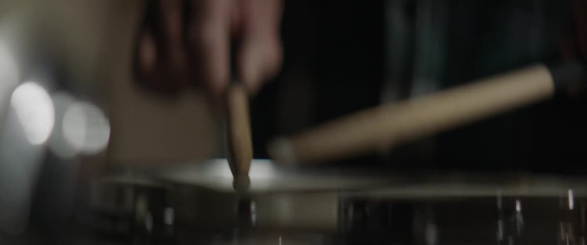 A person is playing the drums