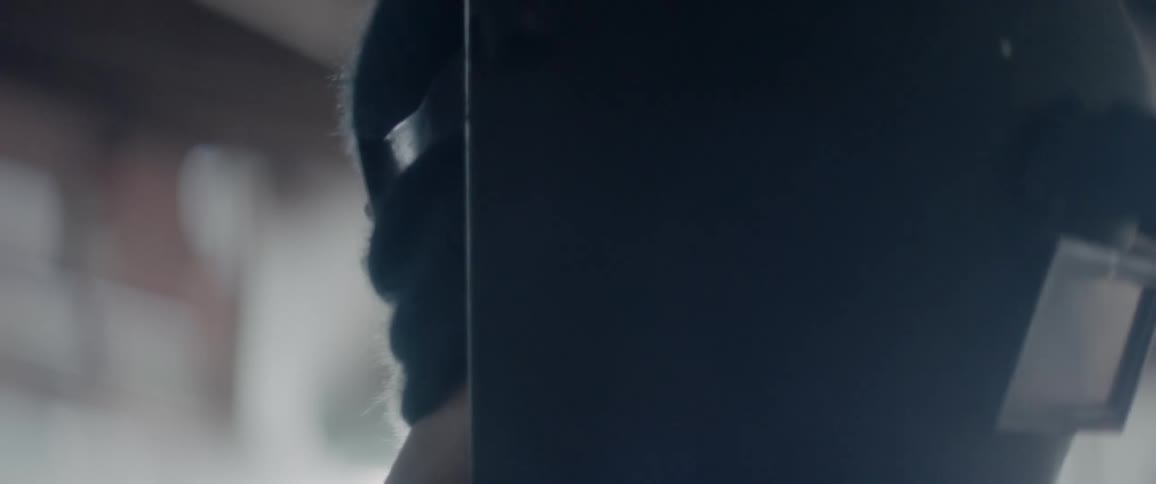 Side of a person's head illuminated by sunlight