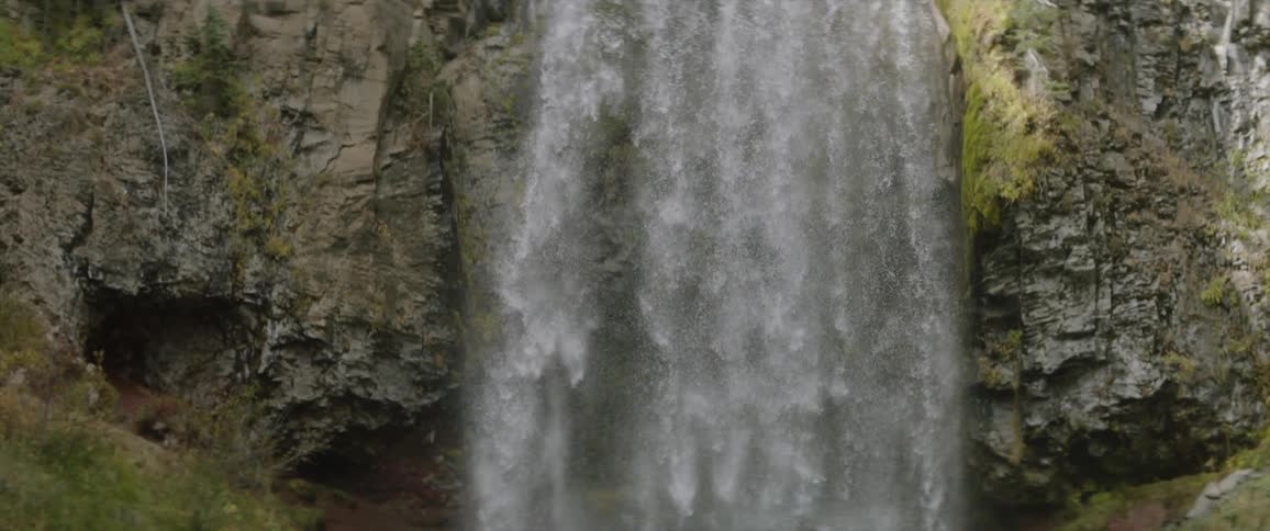 Waterfall flows over a cliff