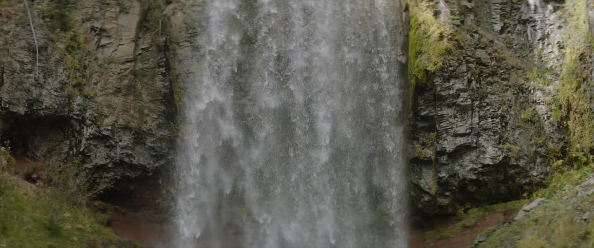 Waterfall flows over a cliff