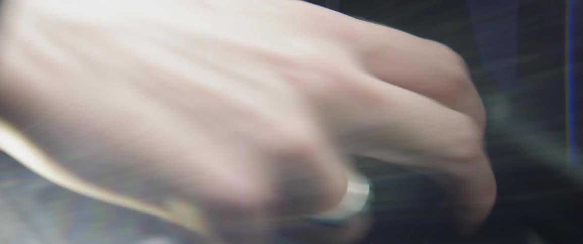 Persons hand pulls the shifter of a vehicle